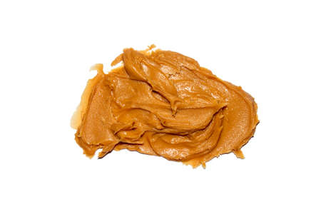Peanut butter made from whole nuts on a white background top view.の写真素材