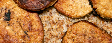 Meat cutlets with buckwheat photo.Buckwheat porridge with cutlets background top view.の写真素材