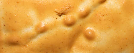 Light brown peanut paste made from whole nuts.Peanut paste background top view.Peanut paste texture top view.Peanut butter cream for spreading.の写真素材