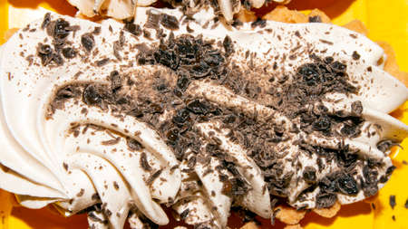 Basket cakes with whipped cream and chocolate top view. Cakes with buttercream and chocolate background.の写真素材