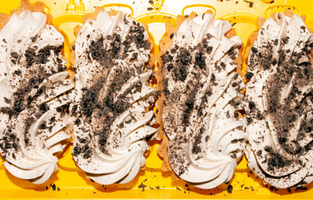 Basket cakes with whipped cream and chocolate top view. Cakes with buttercream and chocolate...
