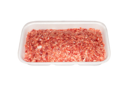 Minced meat in a plastic container top view.Minced meat, isolated on a white background.A piece of...