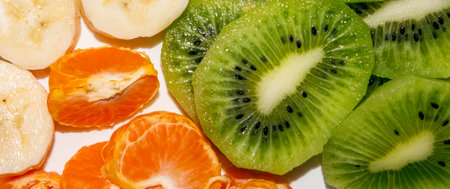 Banana.Kiwi.Mandarin.Slicing of fruits.Fruit background.Fruit mix.A set of fruits.の写真素材