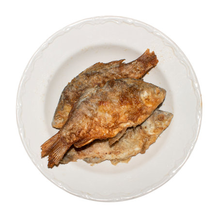 Fried crucian fish.Crucian carp fried in oil.Fried river fish.Fried fish background.Fried fish at home.の写真素材