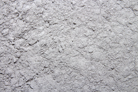 The texture of the cement.The background is made of cement.The gray cement of the m600 brand is high-strength.Cement for construction works.の写真素材