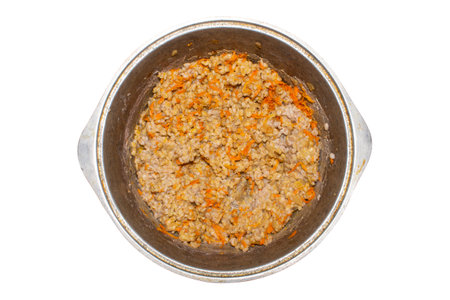 Pearl barley with onions and carrots in a cauldron on a white background.Homemade pearl barley.Boiled pearl barley background.Pearl barley photo.の写真素材