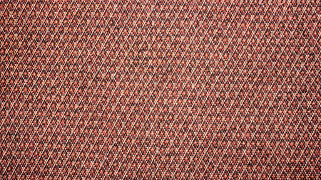 Dense brick-colored diamond-shaped texture.Patterned fabric for furniture upholstery.Diamond-and-speckled fabric background.Thick furniture fabric.の写真素材