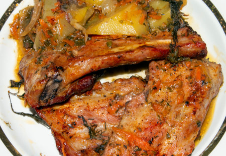 Baked pork ribs with potatoes.Pork ribs with spices.Pork ribs background.Pork rib kebab.Barbecue ribs.の写真素材