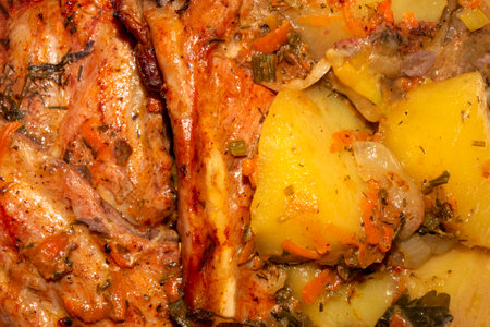 Baked pork ribs with potatoes.Pork ribs with spices.Pork ribs background.Pork rib kebab.Barbecue ribs.の写真素材