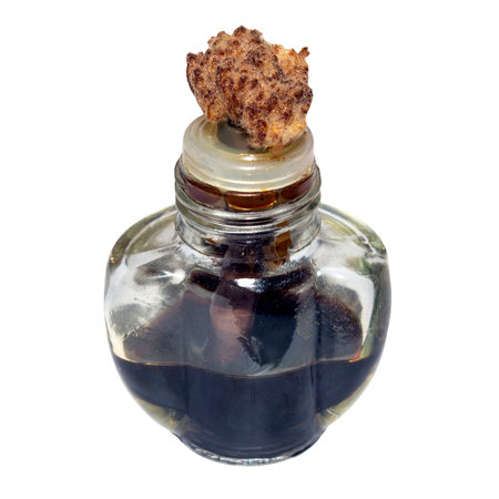 An air freshener filled with tar on a white background.Tar in a glass bottle.Liquid tar for the smell.の写真素材