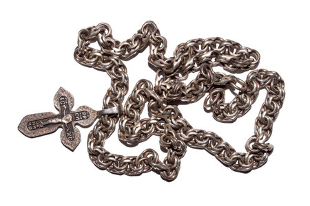 Save and preserve a silver cross with a chain on a white background.Orthodox church silver cross.A...