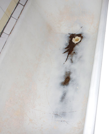 old dirty bathtub, isolated on white background with clipping path.の写真素材