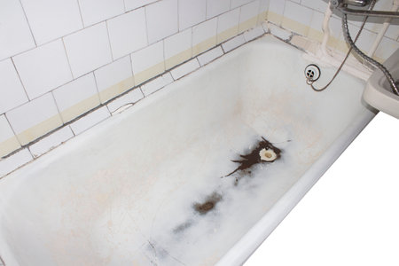 Cast-iron bathtub for restoration.An old cast-iron bathtub for acrylic coating.Cast-iron bathtub after cleaning.An old bathtub for restoration with enamel or acrylic.The bathroom is worn out.の写真素材