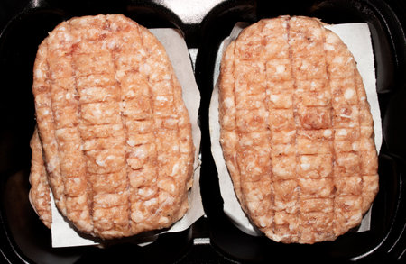 Fresh raw beef and pork patties.Minced meat chop.Fresh minced meat in the form of patties for frying.Cutlets background.の写真素材