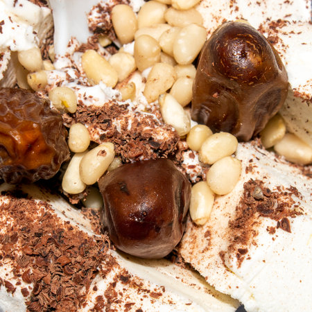 Ice cream with chocolate and nuts.Ice cream with pine nuts.Ice cream with chocolate chips.Ice cream by weight background.の写真素材