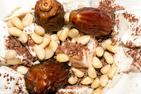 Ice cream with chocolate and nuts.Ice cream with pine nuts.Ice cream with chocolate chips.Ice cream by weight background.の写真素材