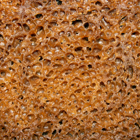 The texture of bread made from sprouted grains on sourdough.Whole-grain, yeast-free bread.Rye bread photo.A piece of bread background.の写真素材