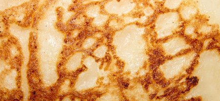 Pancakes texture. Pancakes background. Homemade Russian pancakes with a golden crust. Fried...