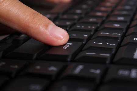 Close-up of woman hands on computer keyboardの写真素材