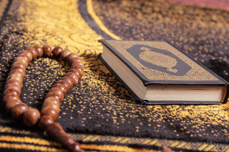The Masbaha is also known as Tasbih is a string of prayer beads which is traditionally used by Muslims to keep track of counting in tasbih - seen here with the Quaranの写真素材