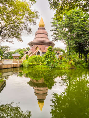 temple in the garden with lagoon and treeの写真素材