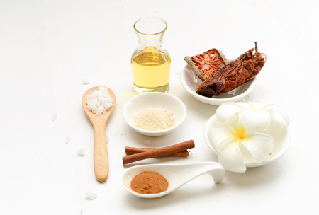 Beautiful set of spa composition with Thai herb and oil on white backgroundの写真素材