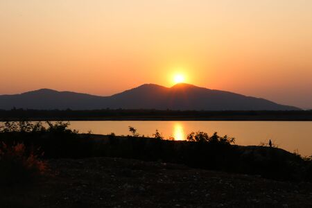 Sunset on the mountain at Huay Mai Teng water reservoir in Ratchaburi, Thailandの写真素材