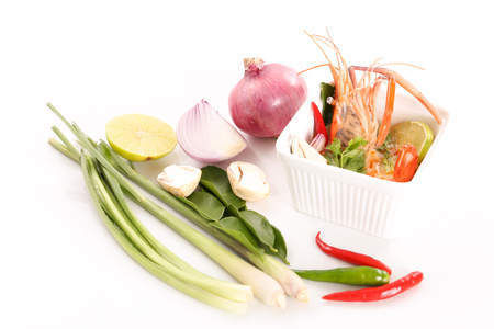 Hot and sour Thai soup with shrimp - Tom Yam Kung in white background - top viewの写真素材