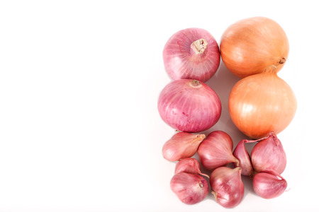 French red shallots and onions on white background -top view with copy spaceの写真素材
