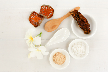 Spa composition with Thai herb and tamarind on white background with copy space - Top viewの写真素材