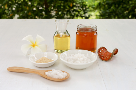 Spa composition with Thai herb, honey, oil and  Plumeria flower with bokeh backgroundの写真素材