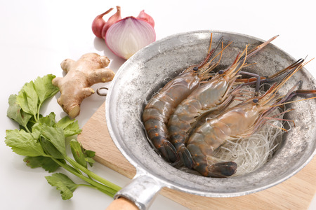 Raw shrimps and vegetables for Thai baked shrimp with glass noodleの写真素材
