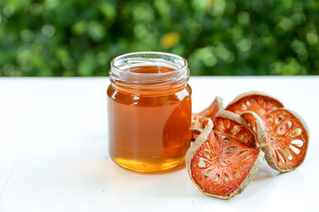 Honey and dry bael fruit with bokeh backgroundの写真素材