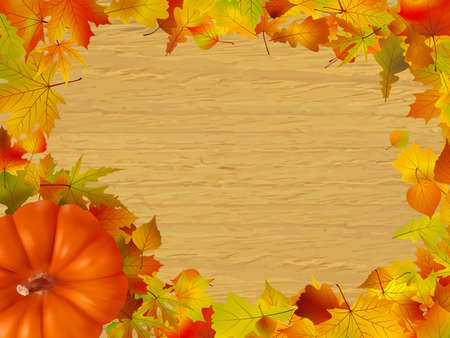 Fall leaves and pumpkins on wood background.の写真素材