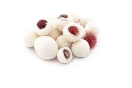Berries in sugar powder. Isolated on white backgroundの写真素材