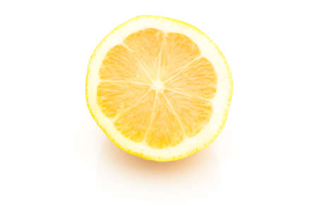 Single cross section of lemon. Isolated on white background. Close-up. Studio photography.の写真素材