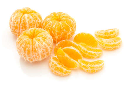 lices of peeled orange on white backgroundの写真素材