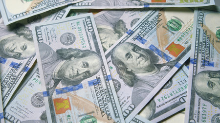 Stacks of Cash A Large Collection of U.S. Dollar Bills Piled Together Neatly and Organizedの写真素材