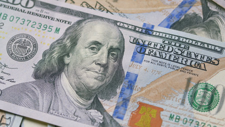 Closeup of U.S. Hundred Dollar Bills showcasing their design, texture, and significanceの写真素材