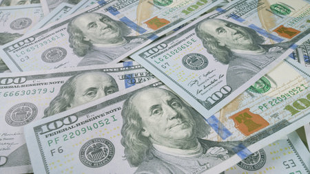 A Collection of Hundred Dollar Bills A Symbol of Wealth and Prosperity in the Economy