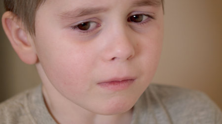 Emotional Child Portrait Capturing a Profound Moment of Sadness and Reflection in Life