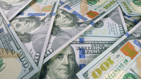 A CloseUp View of Several American Hundred Dollar Bills Spread Out Neatly for Display
