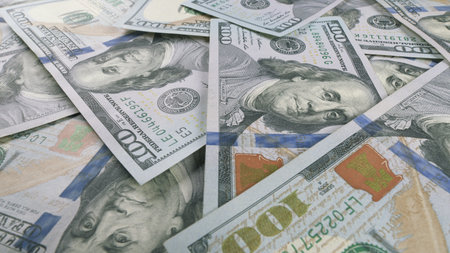 Closeup View of Multiple U.S. Dollar Bills Stacked Together Neatly and Clearly Visible