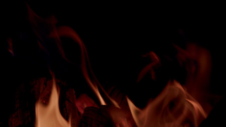 Captivating Flames in the Dark An Engaging and Entrancing Mesmerizing Fire Video Experienceの写真素材