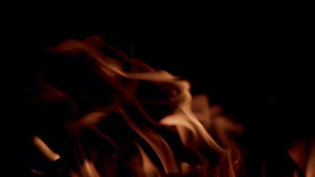 Captivating Flames are Constantly Dancing Passionately in the Dark, Creating a Mesmerizing Displayの写真素材