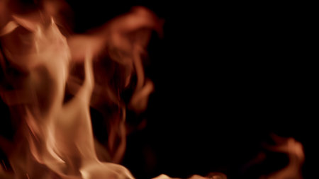 Dynamic Flames with Vibrant Orange and Deep Red Hues Set Against a Black Backgroundの写真素材