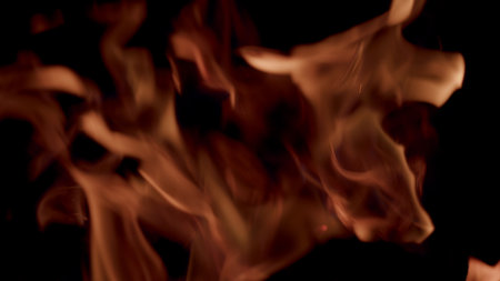 Dynamic Flames Illuminating the Darkness All Around, Captivating the Observers Visionの写真素材