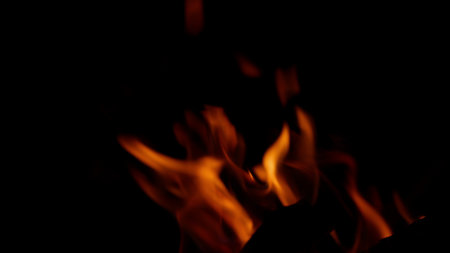 The Captivating Flames Dance Gracefully in the Dark, Creating a Mesmerizing Displayの写真素材