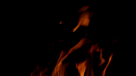 The Dynamic Flames Against a Completely Black Background Present a Captivating Visual Displayの写真素材