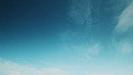 Time lapse. The Serene Sky displays breathtaking blue and white clouds, creating a tranquil atmosphereの写真素材